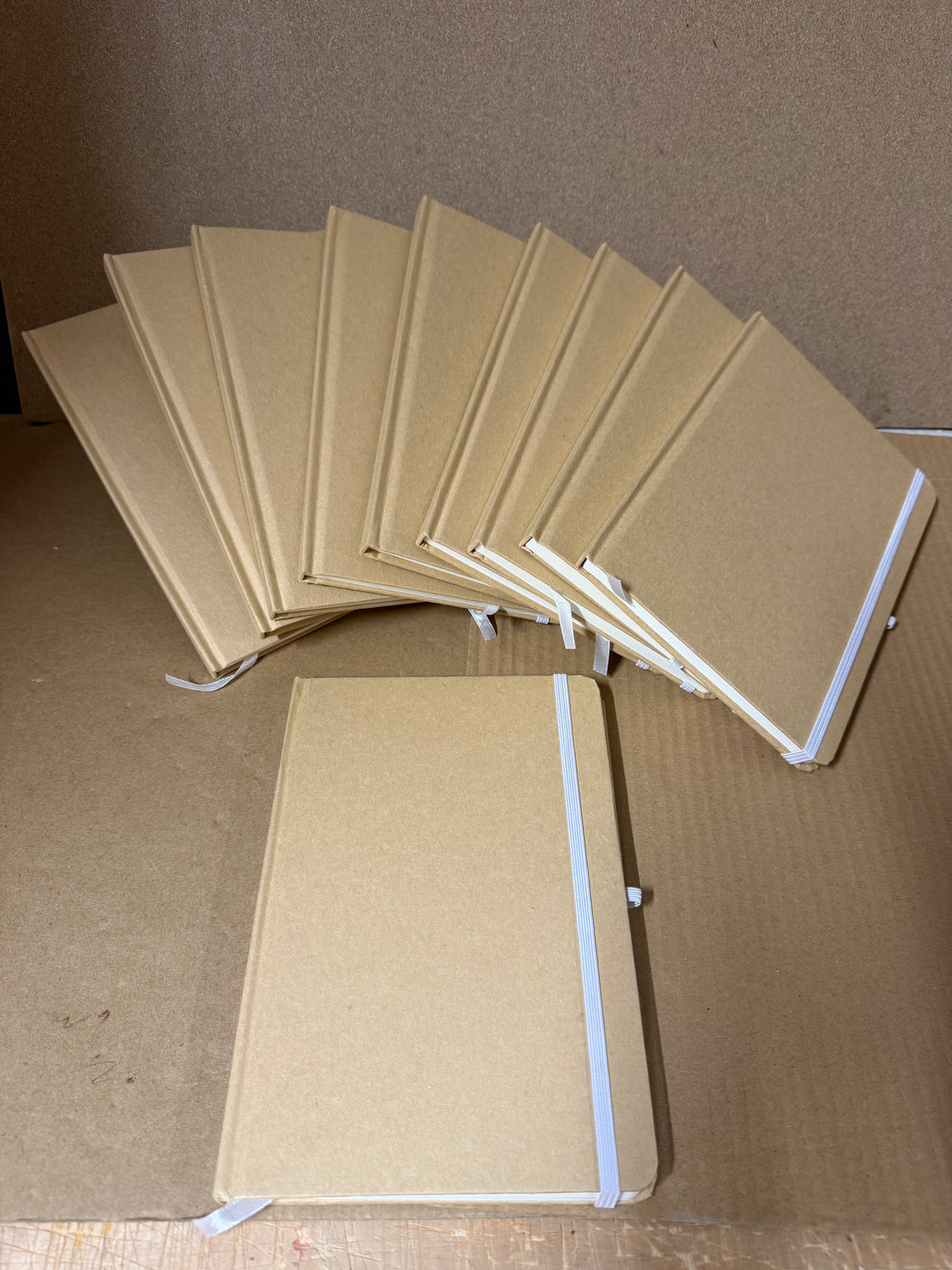 Bundle of 10x A5 hardback notebooks with coloured closure