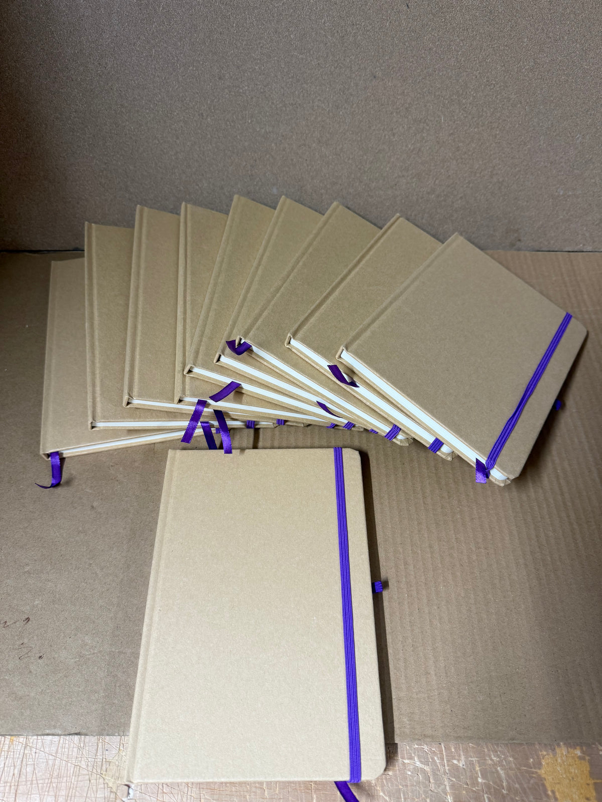 Bundle of 10x A5 hardback notebooks with coloured closure